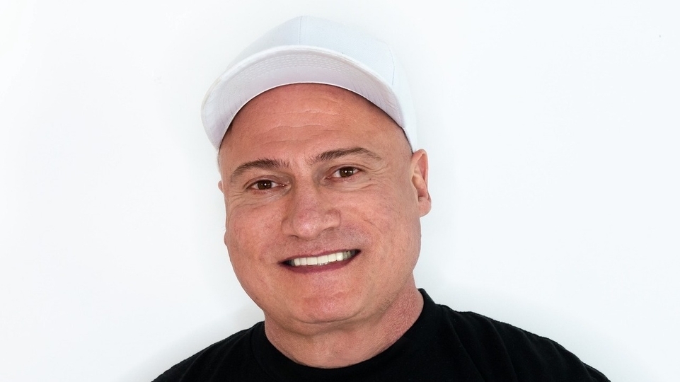 Danny Tenaglia wearing a white baseball cap