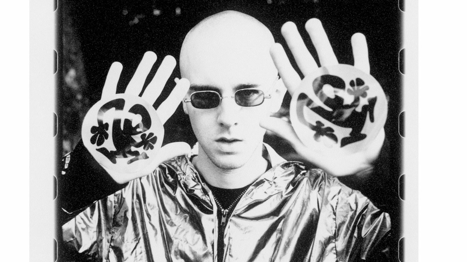 Ritchie Hawtin poses as Plastikman with ‘Sheet One’ artwork drawn on his palms