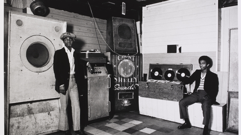 Dennis Morris, 'Aces Club, Count Shelly Sound System, Hackney’, 1974 (photographed), 2010 (printed) © Dennis Morris Courtesy Victoria and Albert Museum, London