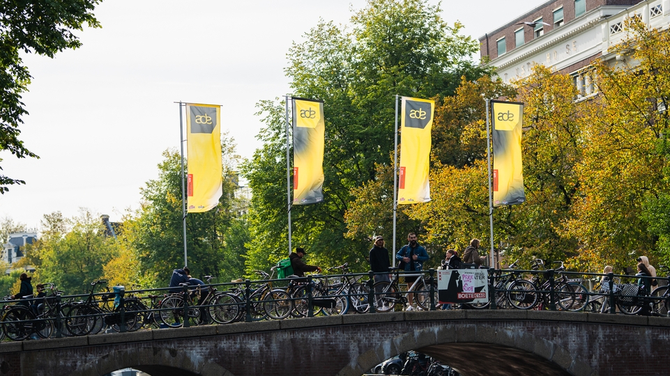 Photo of ADE Flags on a canal bridge in Amsterdam